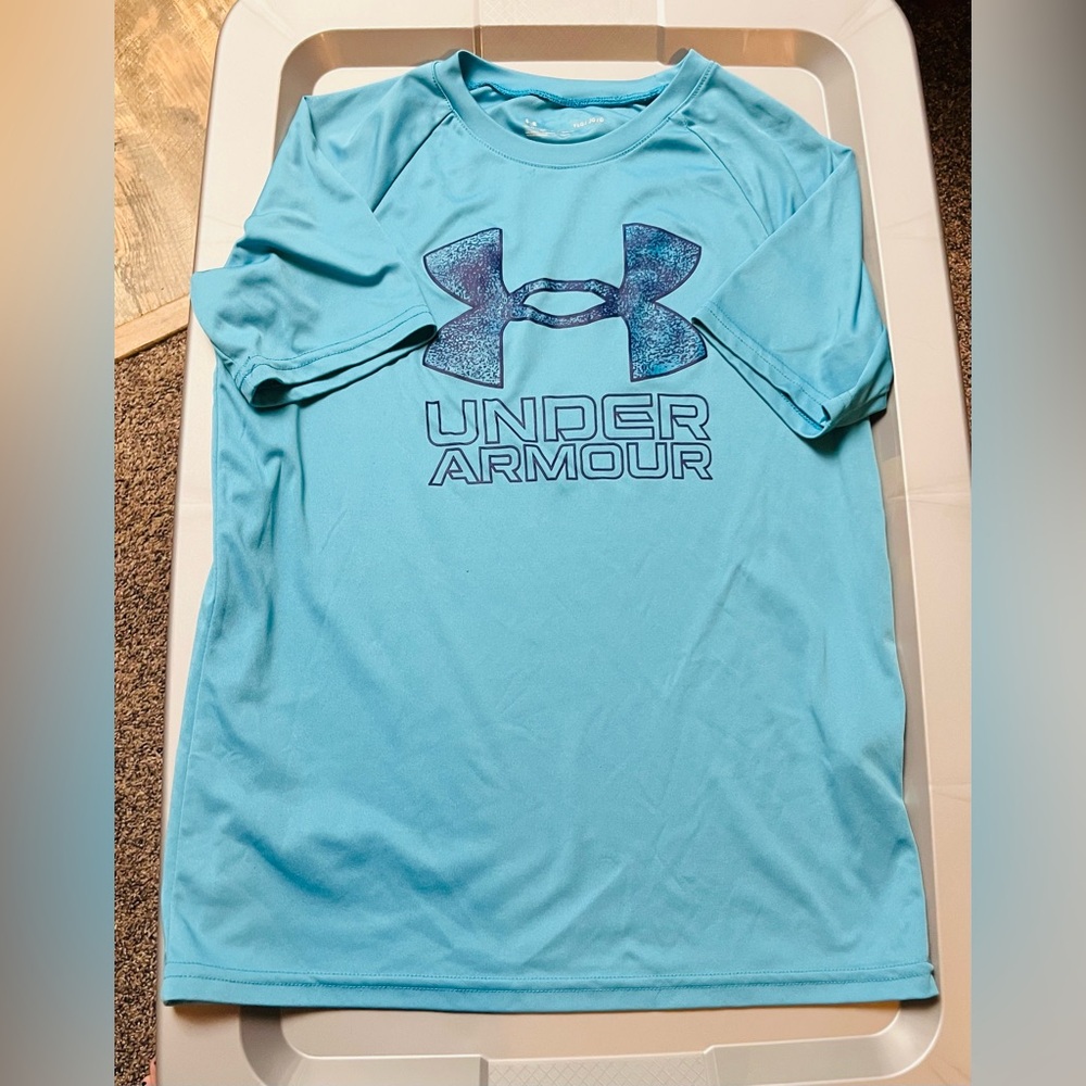 Under Armour boys size large light blue dry-fit short sleeve shirt.